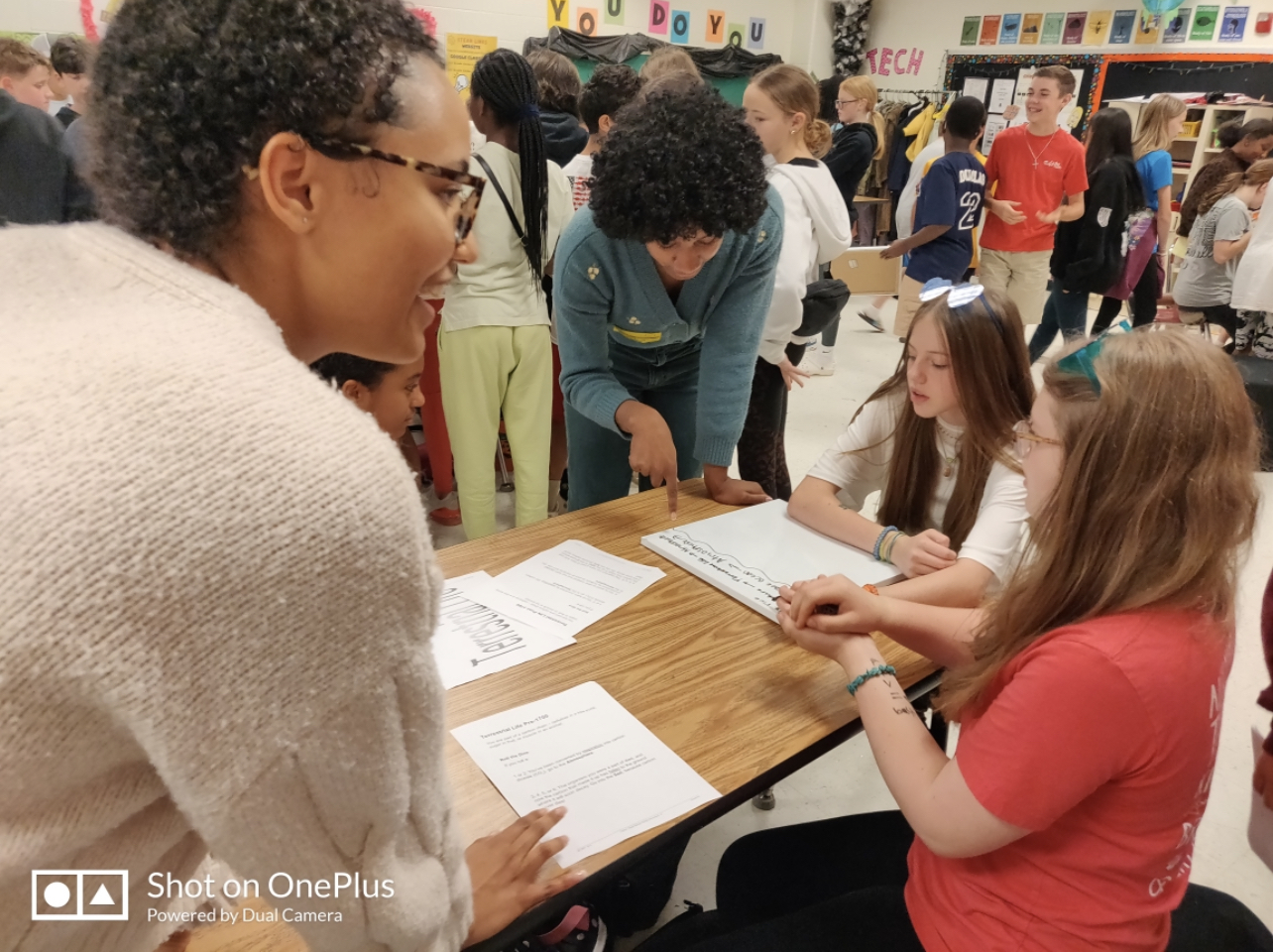 student interns with middle school students